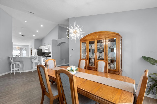 1584 Silhouette Dr, Clermont, FL 34711 - dining space with a chandelier, dark wood finished floors, high vaulted ceiling, and recessed lighting