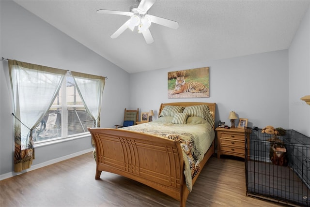 1584 Silhouette Dr, Clermont, FL 34711 - bedroom featuring wood finished floors, vaulted ceiling, and ceiling fan