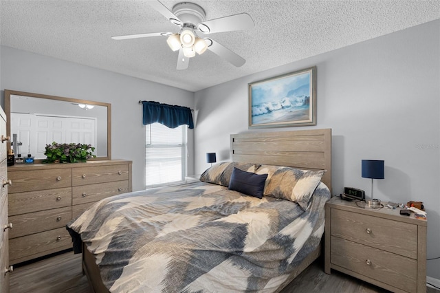 1584 Silhouette Dr, Clermont, FL 34711 - bedroom with a textured ceiling, wood finished floors, and ceiling fan