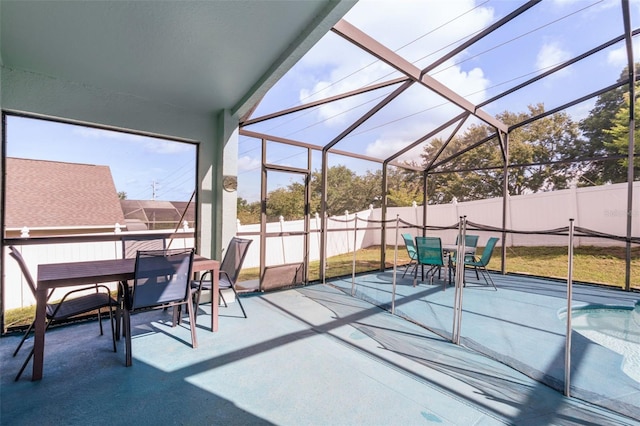 1584 Silhouette Dr, Clermont, FL 34711 - fenced backyard featuring outdoor dining area, a patio area, and glass enclosure