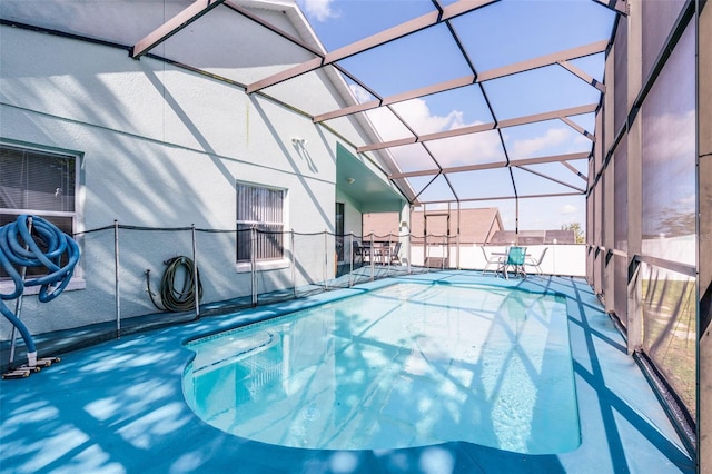 1584 Silhouette Dr, Clermont, FL 34711 - outdoor pool featuring glass enclosure and a patio