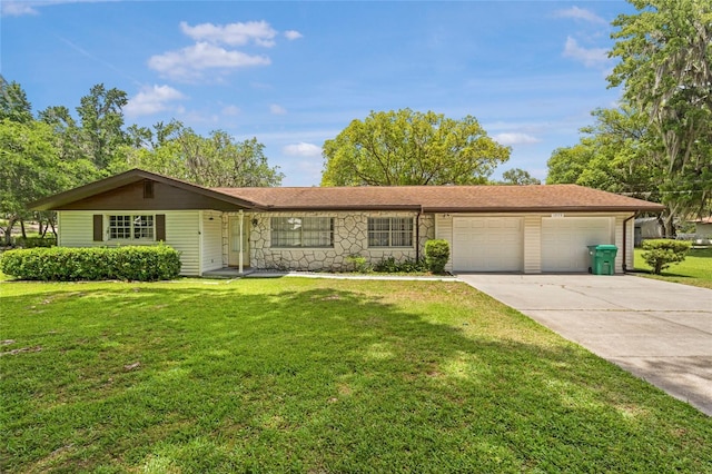 12178 Palmetto Way, Dunnellon, FL 34432 - ranch-style house featuring an attached garage, driveway, a front lawn, and stone siding