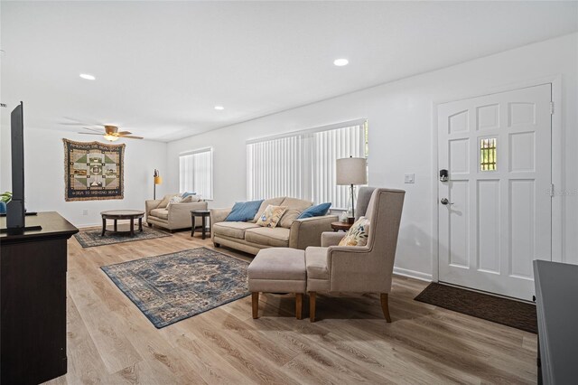 12178 Palmetto Way, Dunnellon, FL 34432 - living area featuring wood finished floors, ceiling fan, and recessed lighting