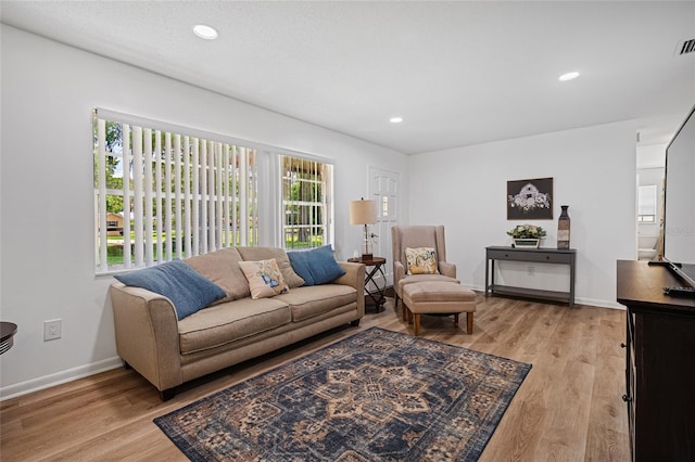 12178 Palmetto Way, Dunnellon, FL 34432 - living area featuring light wood-style flooring and recessed lighting