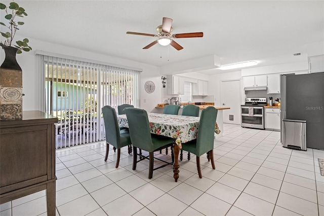 12178 Palmetto Way, Dunnellon, FL 34432 - dining room with a ceiling fan and light tile patterned floors