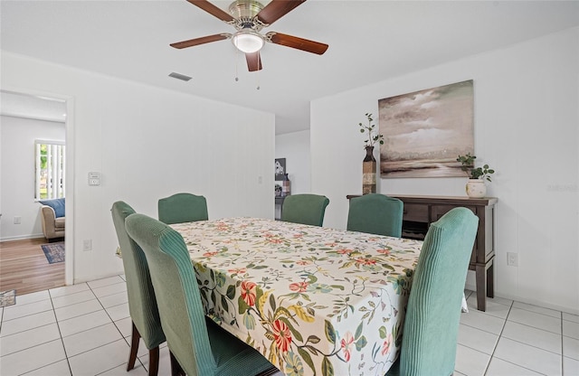 12178 Palmetto Way, Dunnellon, FL 34432 - dining space with light tile patterned floors and ceiling fan