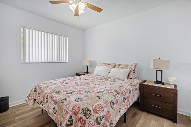 12178 Palmetto Way, Dunnellon, FL 34432 - bedroom with light wood-style floors and a ceiling fan