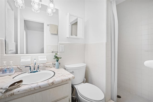 12178 Palmetto Way, Dunnellon, FL 34432 - bathroom featuring vanity, a shower stall, tile walls, and wainscoting