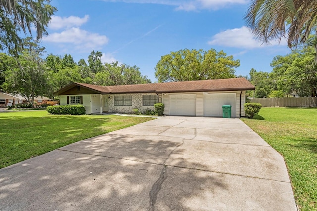 12178 Palmetto Way, Dunnellon, FL 34432 - view of front of property with a garage, driveway, and stone siding