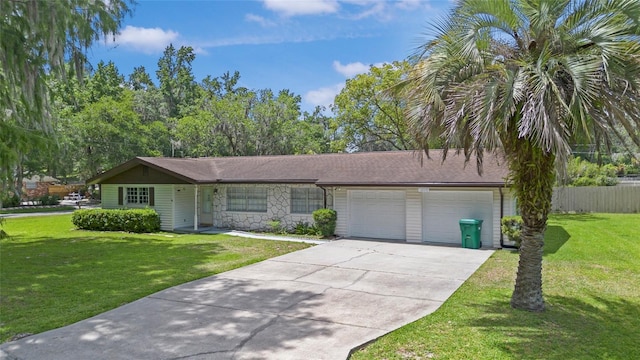 12178 Palmetto Way, Dunnellon, FL 34432 - view of front of property featuring concrete driveway, an attached garage, and stone siding