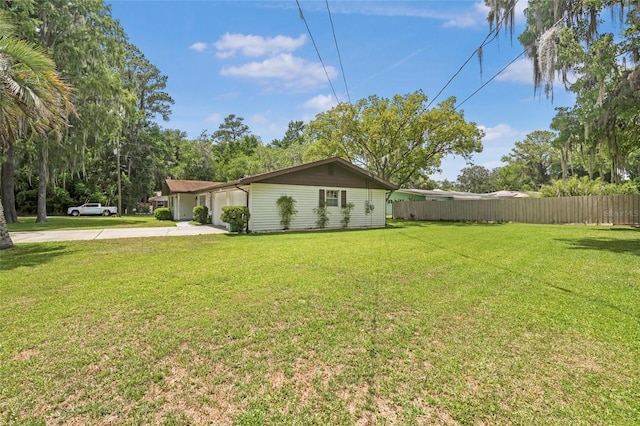 12178 Palmetto Way, Dunnellon, FL 34432 - view of home's exterior with concrete driveway and a garage