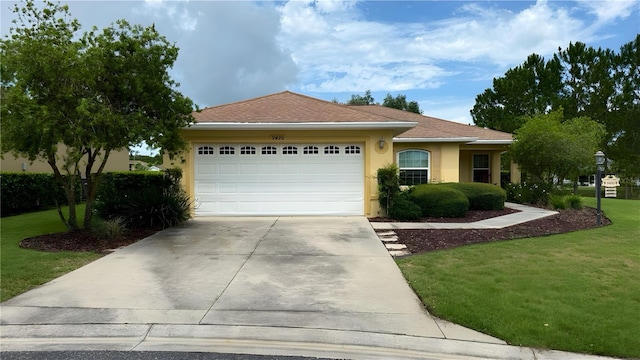 9490 SW 94th Ct, Ocala, FL 34481 - ranch-style home with a garage, a front lawn, concrete driveway, and stucco siding