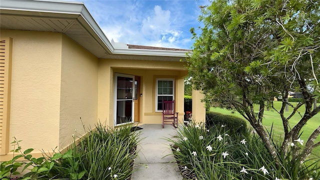 9490 SW 94th Ct, Ocala, FL 34481 - doorway to property featuring stucco siding