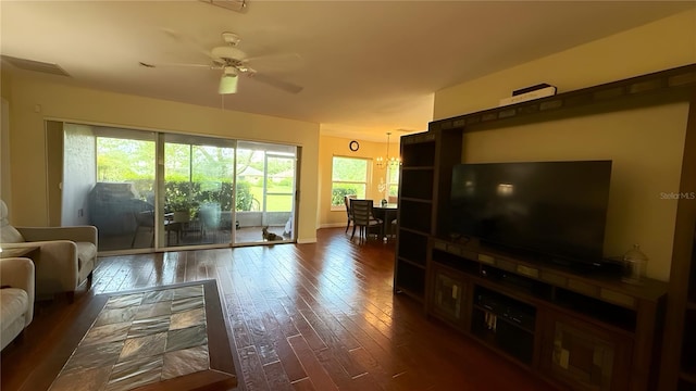 9490 SW 94th Ct, Ocala, FL 34481 - living room with dark wood-type flooring, ceiling fan, and a chandelier