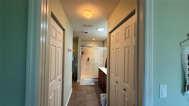 9490 SW 94th Ct, Ocala, FL 34481 - bathroom featuring a closet, a shower stall, tile patterned flooring, and vanity