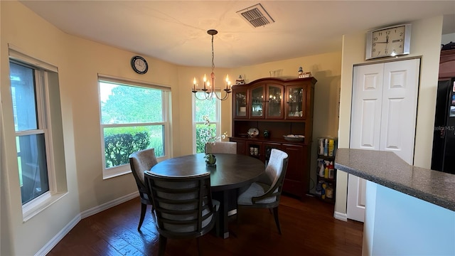 9490 SW 94th Ct, Ocala, FL 34481 - dining area with a chandelier and dark wood-style flooring