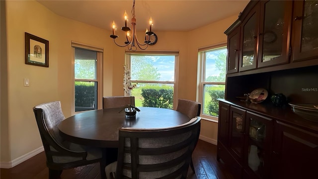 9490 SW 94th Ct, Ocala, FL 34481 - dining space featuring a chandelier, healthy amount of natural light, and dark wood-style flooring