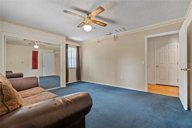 206 N Dundee Way, Inverness, FL 34450 - living room with crown molding, carpet floors, a ceiling fan, and a textured ceiling