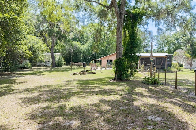206 N Dundee Way, Inverness, FL 34450 - view of green lawn featuring a sunroom