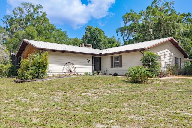 206 N Dundee Way, Inverness, FL 34450 - ranch-style home with a front yard and a metal roof