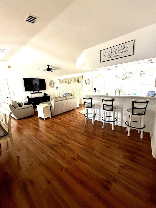 2550 SW Ivy Pl, Dunnellon, FL 34431 - living area featuring wood finished floors, ceiling fan, and lofted ceiling