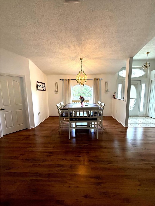 2550 SW Ivy Pl, Dunnellon, FL 34431 - dining space featuring a chandelier, a textured ceiling, and wood finished floors