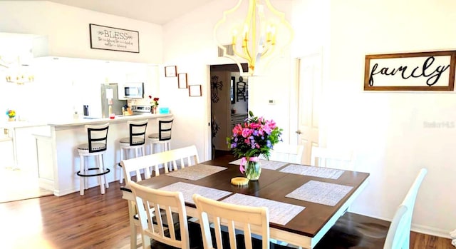 2550 SW Ivy Pl, Dunnellon, FL 34431 - dining space with a chandelier and wood finished floors