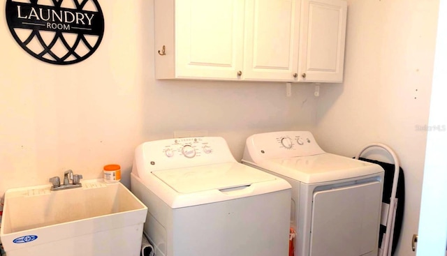 2550 SW Ivy Pl, Dunnellon, FL 34431 - washroom featuring separate washer and dryer and cabinet space