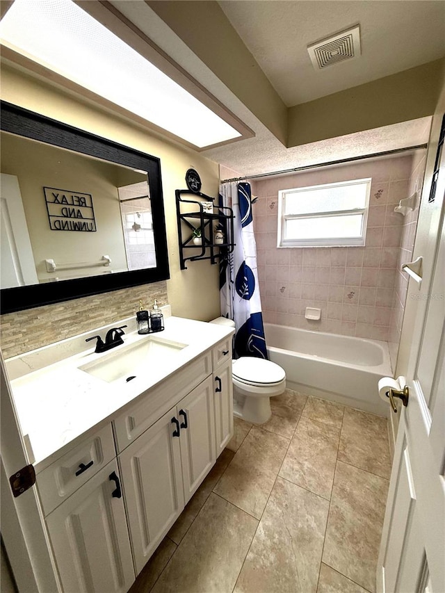 2550 SW Ivy Pl, Dunnellon, FL 34431 - bathroom featuring vanity, shower / tub combo, tasteful backsplash, and tile patterned floors
