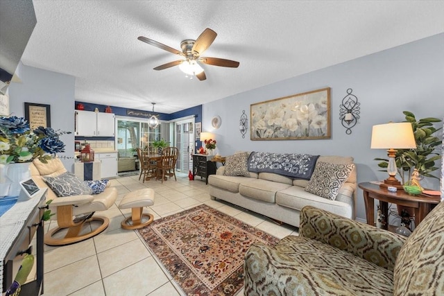 7961 Midway Drive Ter Unit J102, Ocala, FL 34472 - living area with ceiling fan, light tile patterned floors, and a textured ceiling