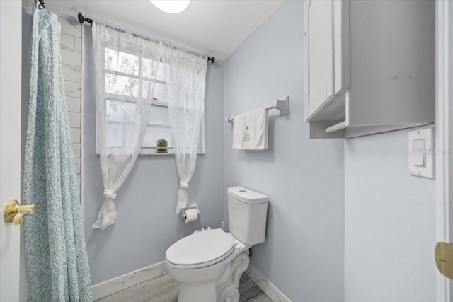 7961 Midway Drive Ter Unit J102, Ocala, FL 34472 - bathroom with baseboards and toilet