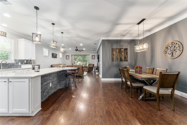 7839 SW 97th Cir, Ocala, FL 34481 - dining space featuring dark wood-type flooring, ornamental molding, plenty of natural light, ceiling fan, and recessed lighting