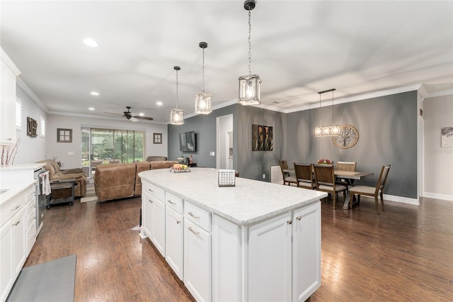 7839 SW 97th Cir, Ocala, FL 34481 - kitchen featuring a ceiling fan, recessed lighting, crown molding, a kitchen island, and dark wood-style floors