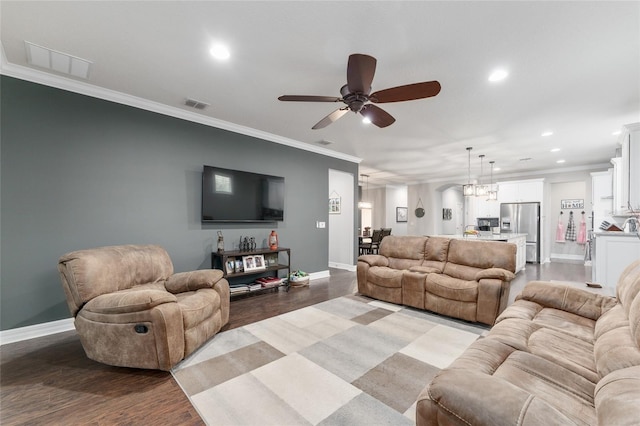 7839 SW 97th Cir, Ocala, FL 34481 - living room with a ceiling fan, light wood-type flooring, recessed lighting, crown molding, and a chandelier