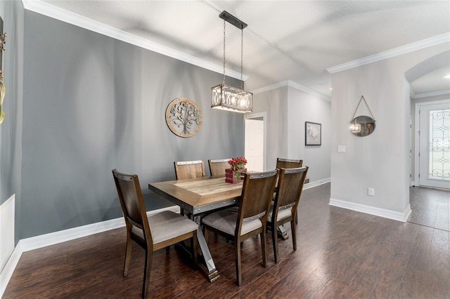 7839 SW 97th Cir, Ocala, FL 34481 - dining space with arched walkways, dark wood finished floors, ornamental molding, and a chandelier