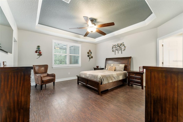 7839 SW 97th Cir, Ocala, FL 34481 - bedroom with a tray ceiling, a textured ceiling, dark wood-style floors, ornamental molding, and ceiling fan
