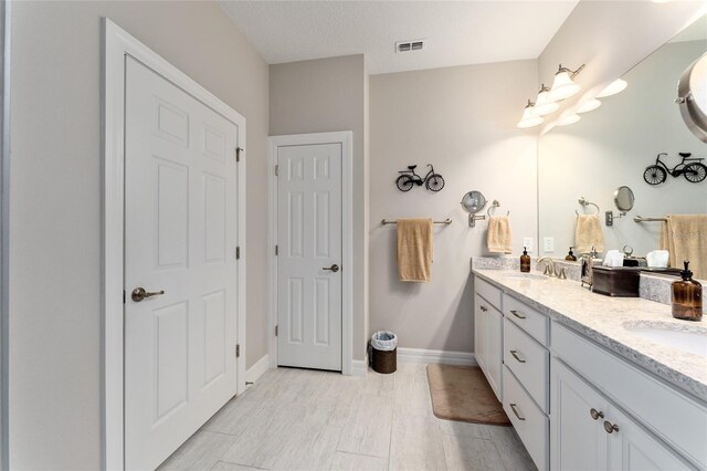 7839 SW 97th Cir, Ocala, FL 34481 - full bath featuring double vanity and baseboards