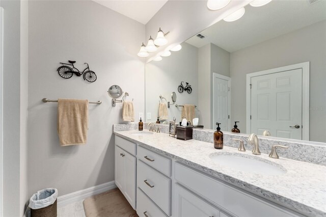 7839 SW 97th Cir, Ocala, FL 34481 - bathroom featuring double vanity and baseboards