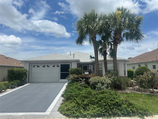 9730 SW 90th St, Ocala, FL 34481 - single story home featuring driveway, an attached garage, and stucco siding