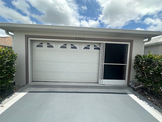 9730 SW 90th St, Ocala, FL 34481 - garage with concrete driveway