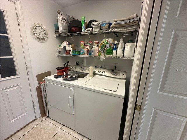 9730 SW 90th St, Ocala, FL 34481 - washroom with washer and clothes dryer and light tile patterned floors