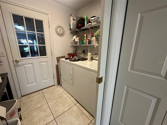 9730 SW 90th St, Ocala, FL 34481 - washroom featuring separate washer and dryer and light tile patterned floors