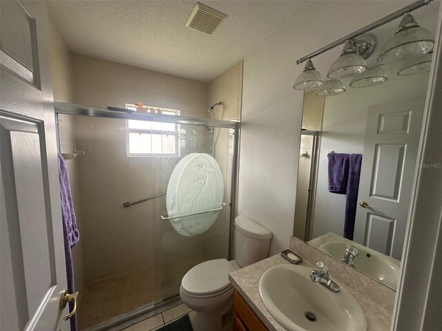9730 SW 90th St, Ocala, FL 34481 - bathroom with a stall shower, vanity, a textured ceiling, and tile patterned flooring