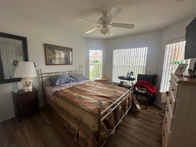 9730 SW 90th St, Ocala, FL 34481 - bedroom featuring dark wood-style floors, ceiling fan, and a textured ceiling