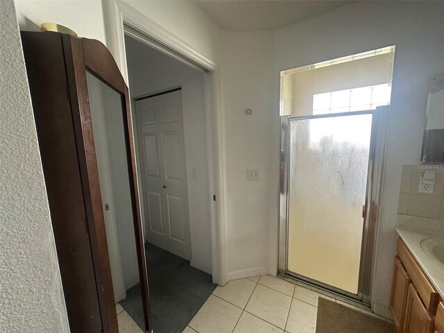 9730 SW 90th St, Ocala, FL 34481 - bathroom featuring a stall shower, tile patterned floors, and vanity