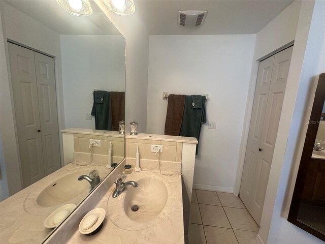 9730 SW 90th St, Ocala, FL 34481 - bathroom featuring a closet, vanity, and tile patterned flooring