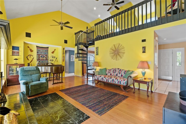 10230 289th St E, Myakka City, FL 34251 - living area featuring a ceiling fan, stairs, high vaulted ceiling, and wood finished floors