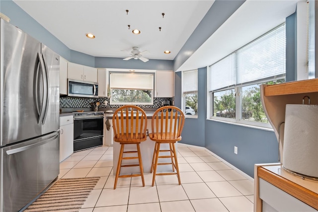 10230 289th St E, Myakka City, FL 34251 - kitchen with appliances with stainless steel finishes, healthy amount of natural light, tasteful backsplash, and recessed lighting