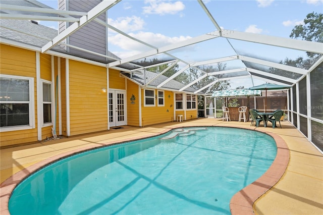 10230 289th St E, Myakka City, FL 34251 - swimming pool featuring french doors, a patio, and glass enclosure