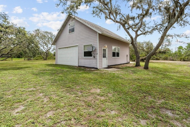 10230 289th St E, Myakka City, FL 34251 - view of property exterior with a detached garage and a lawn